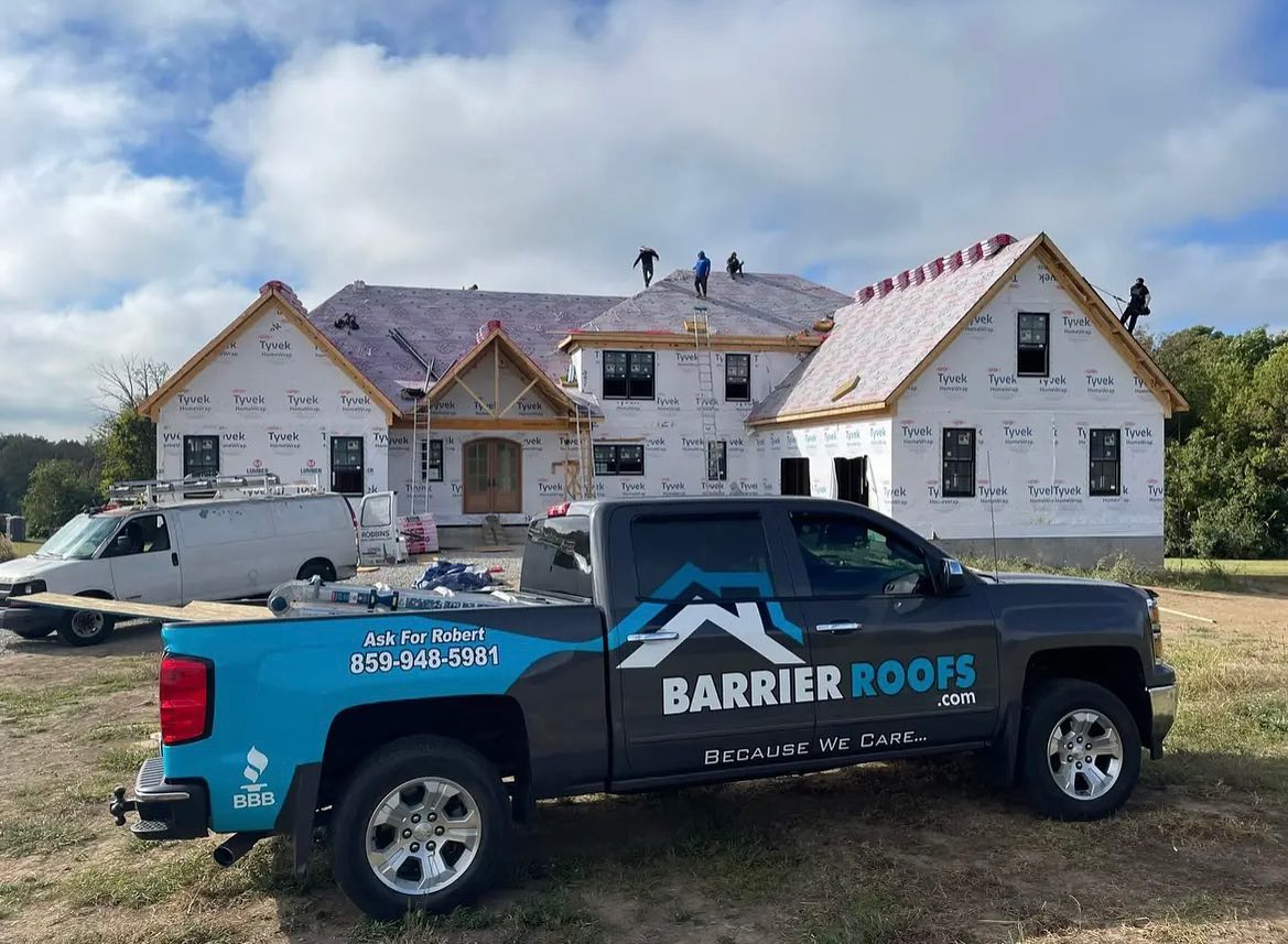 Barrier Roofs team working on a roof installation in Lexington, KY