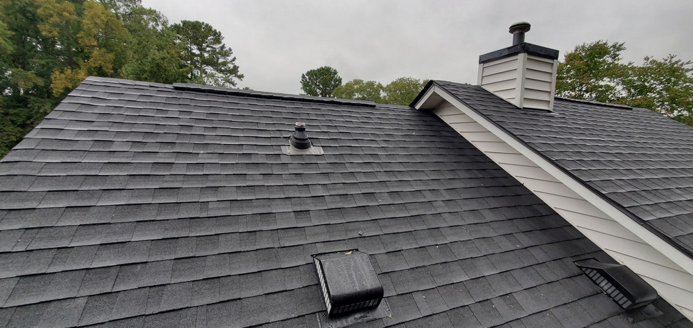 Newly Installed Black Asphalt Architectural Shingles on a Residential Home: Architecture, Roofing, Real Estate