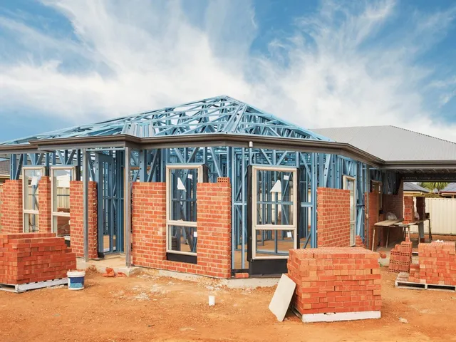 Home under construction showing brick masonry work being done