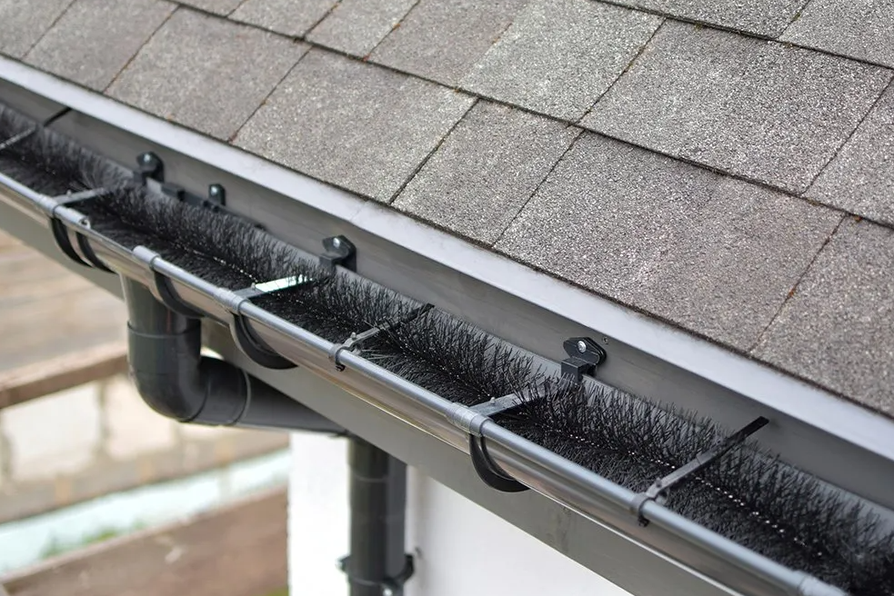 Gutter install showing protection guard from leaves