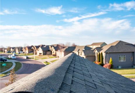 top of a shingled roof in neighbor