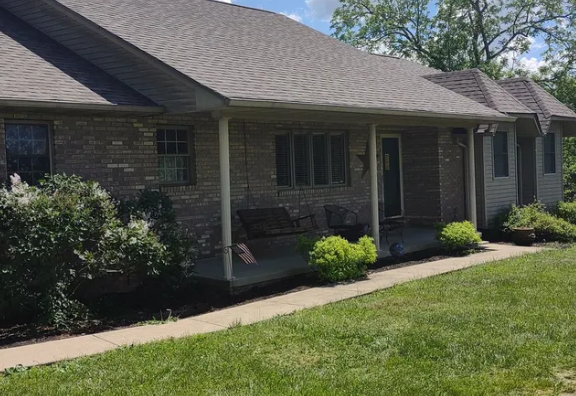 Home with new shingles after a full roof replacement in London, KY