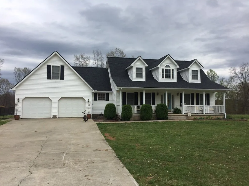Front view of a completed home roof replacement and soffit repair in London, KY