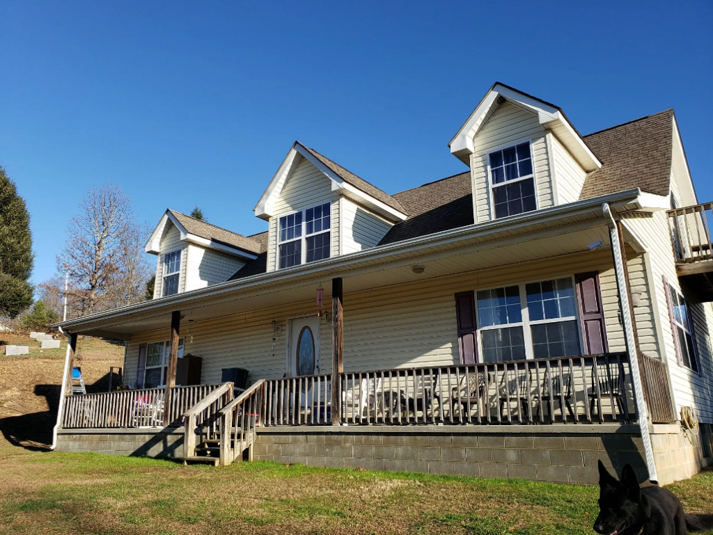 Home with newly replaced roof by Barrier Roofs in Rockhold, KY